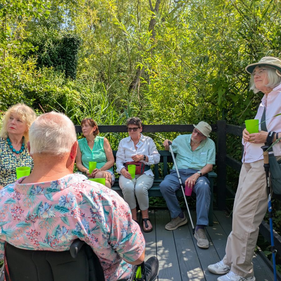 A group of people using mixed mobility aids including a wheelchair, enjoy a refreshing glass of squash on a very hot day, at the new accessible viewing area next to the Kingfisher hide. A group of people using mixed mobility aids including a wheelchair, enjoy a refreshing glass of squash on a very hot day, at the new accessible viewing area next to the Kingfisher hide.